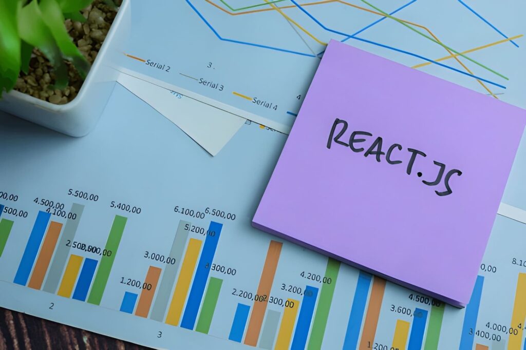 React.js sticky note placed on data charts and graphs representing technical SEO optimization for React applications